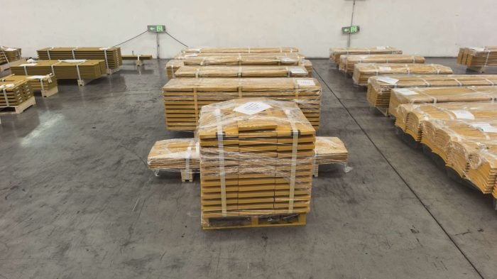 Palletized metal parts prepared for automated handling